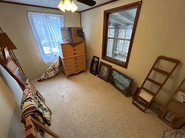 a view of a livingroom with furniture and window