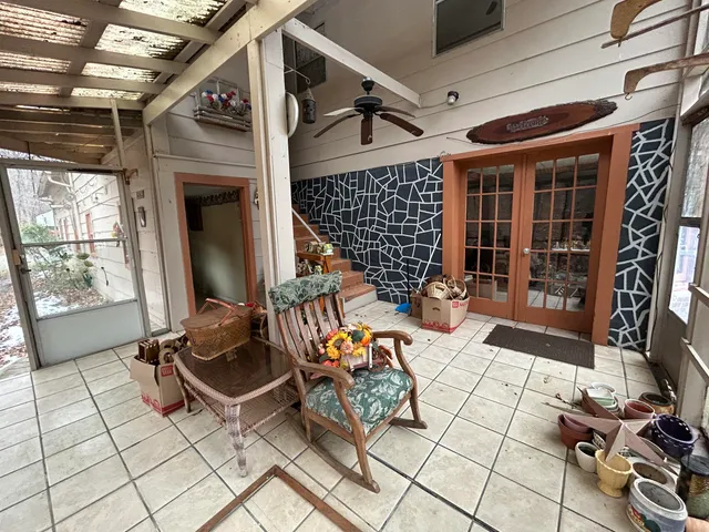 a living room with patio furniture