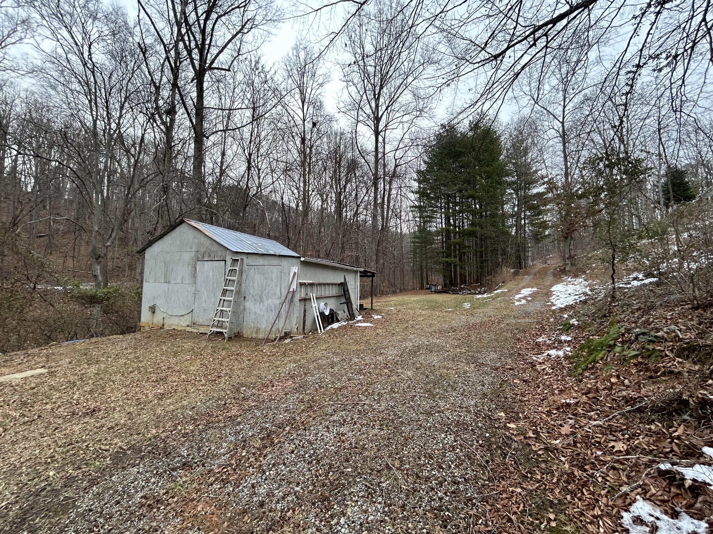 308 Spring Hollow Road Troutville, VA 24175 - Photo 21 of 24 a house with trees in the background