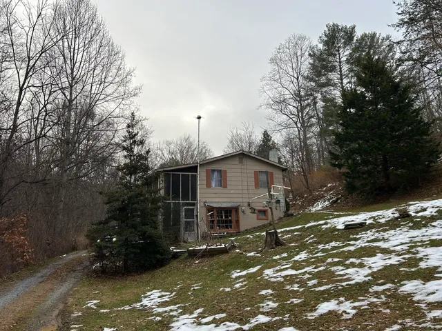 a backyard of a house with lots of green space