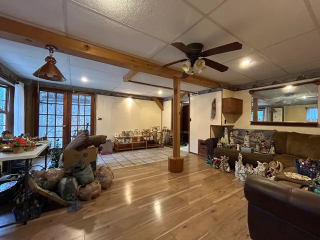 a living room with lots of furniture and white walls