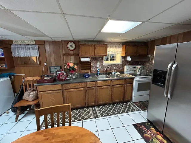 a kitchen with stainless steel appliances granite countertop a sink and cabinets