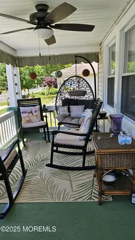 a view of a chairs and table in a balcony