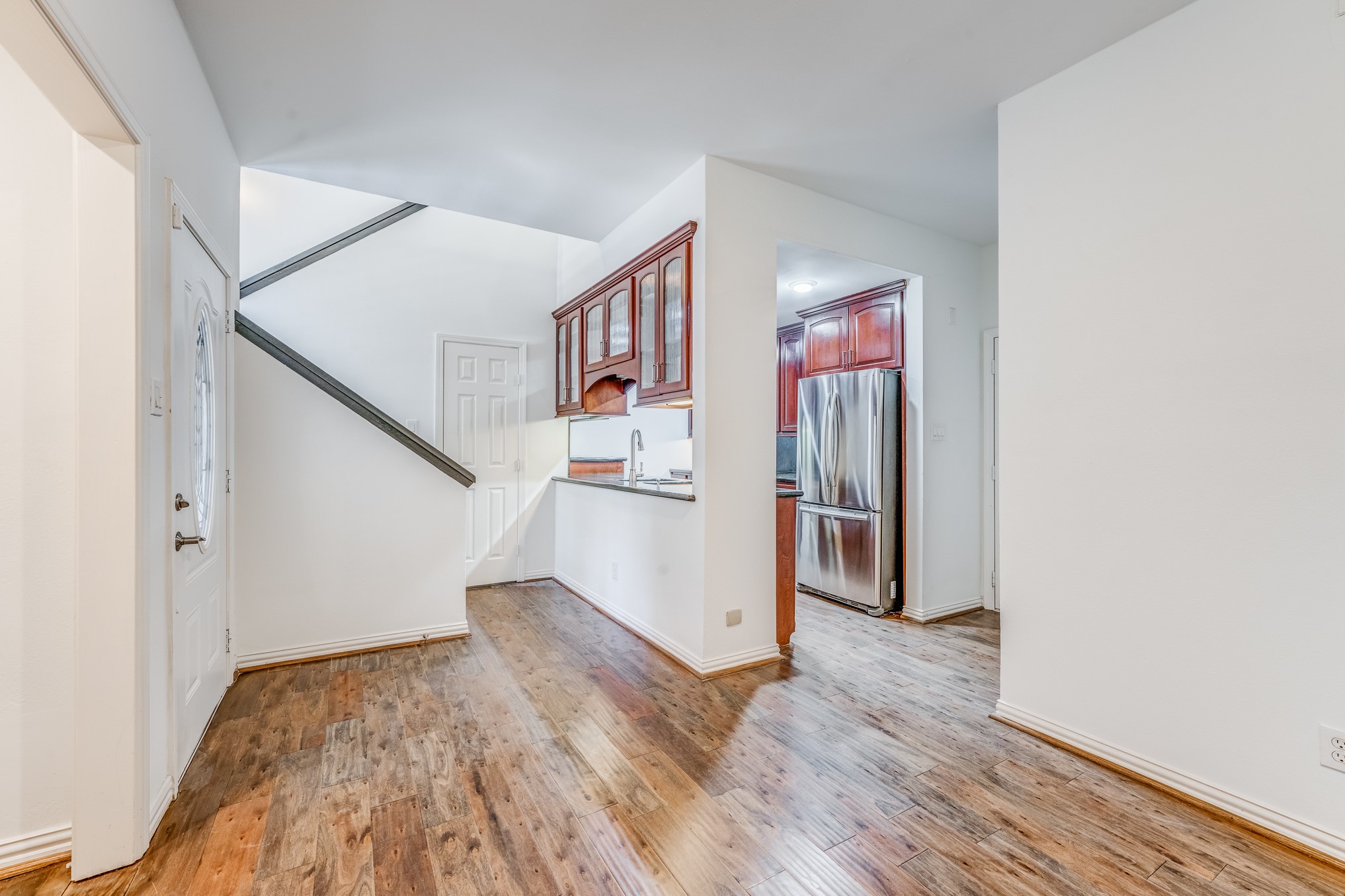 708 Fowler Street Houston, TX 77007 - Photo 21 of 42 a view of a livingroom with wooden floor and stairs
