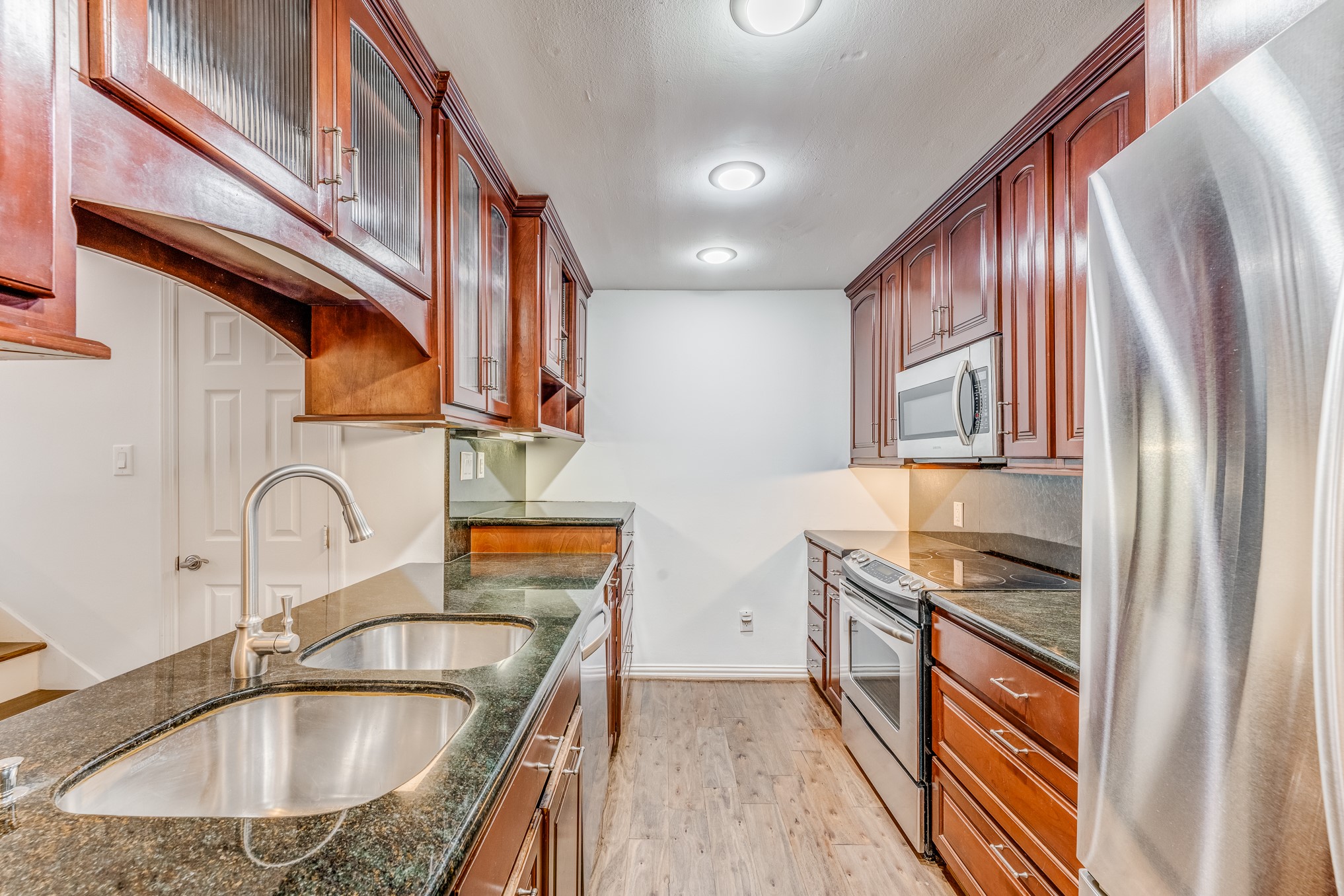 708 Fowler Street Houston, TX 77007 - Photo 33 of 42 a kitchen with stainless steel appliances granite countertop a sink stove and refrigerator