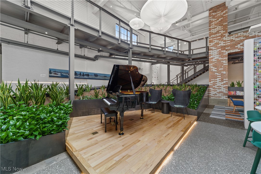 2048 Fulton Road, Unit 107 Cleveland, OH 44113 - Photo 9 of 37 View of piano and indoor plants in community living space
