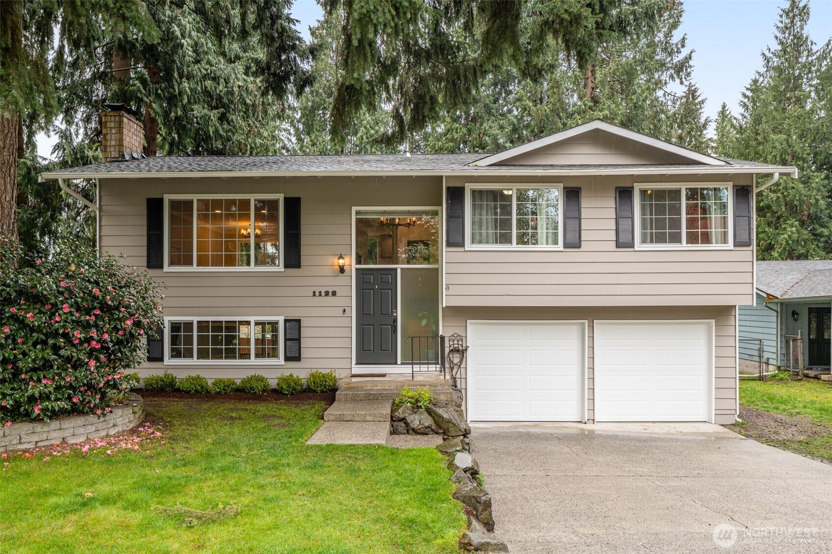 front view of a house with a yard