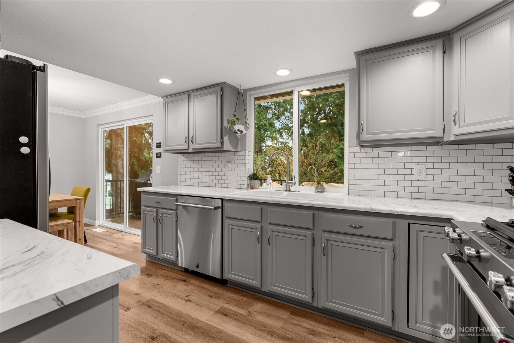 1128 203rd Place Southeast Bothell, WA 98012 - Photo 17 of 38 a kitchen with a sink stove and cabinets