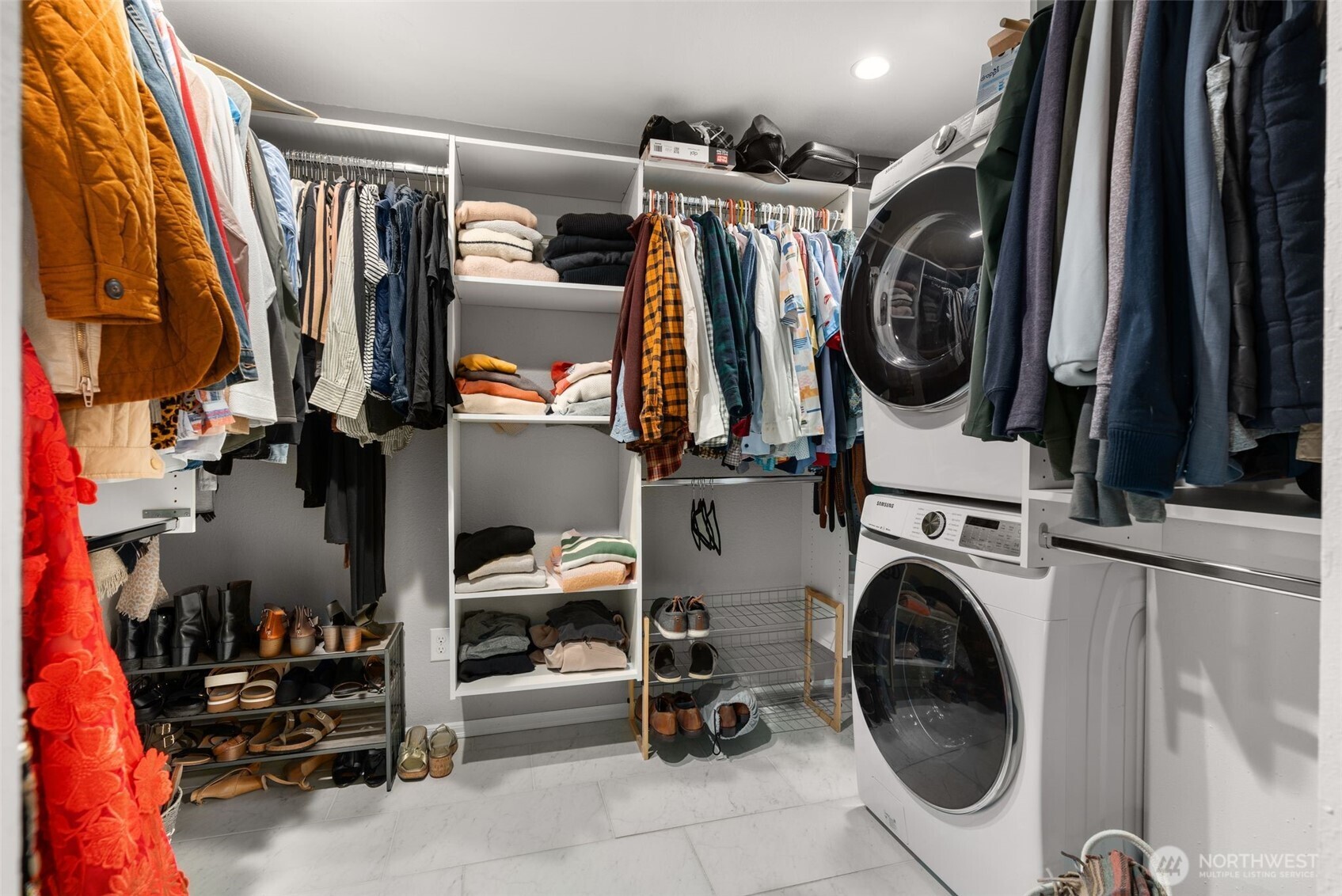 1128 203rd Place Southeast Bothell, WA 98012 - Photo 22 of 38 a view of walk in closet with clothes and shoes