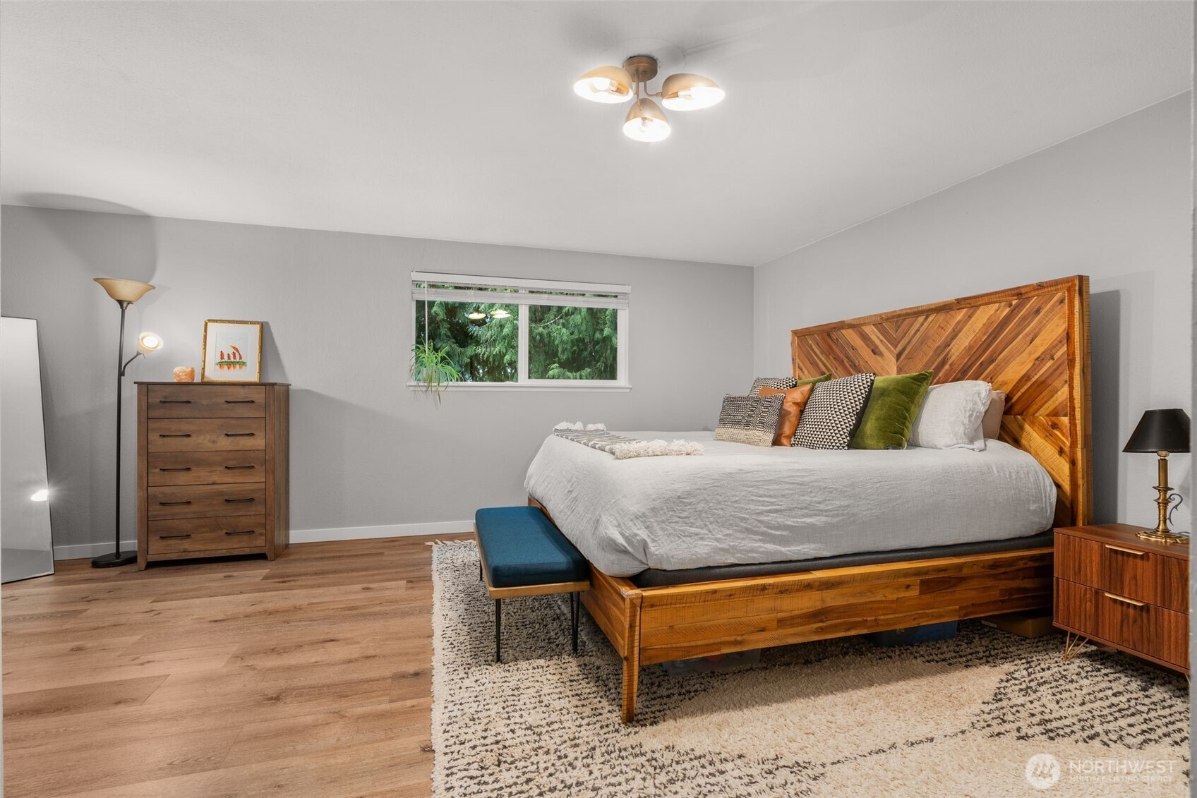 1128 203rd Place Southeast Bothell, WA 98012 - Photo 24 of 38 a bedroom with a bed and a chandelier