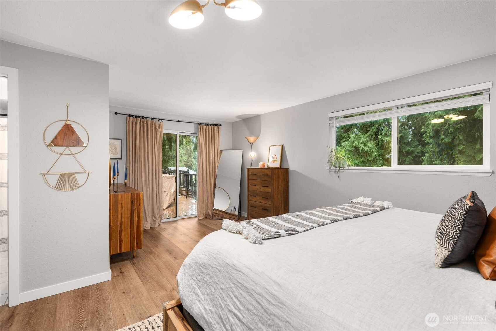 1128 203rd Place Southeast Bothell, WA 98012 - Photo 25 of 38 a bedroom with a bed and wooden floor