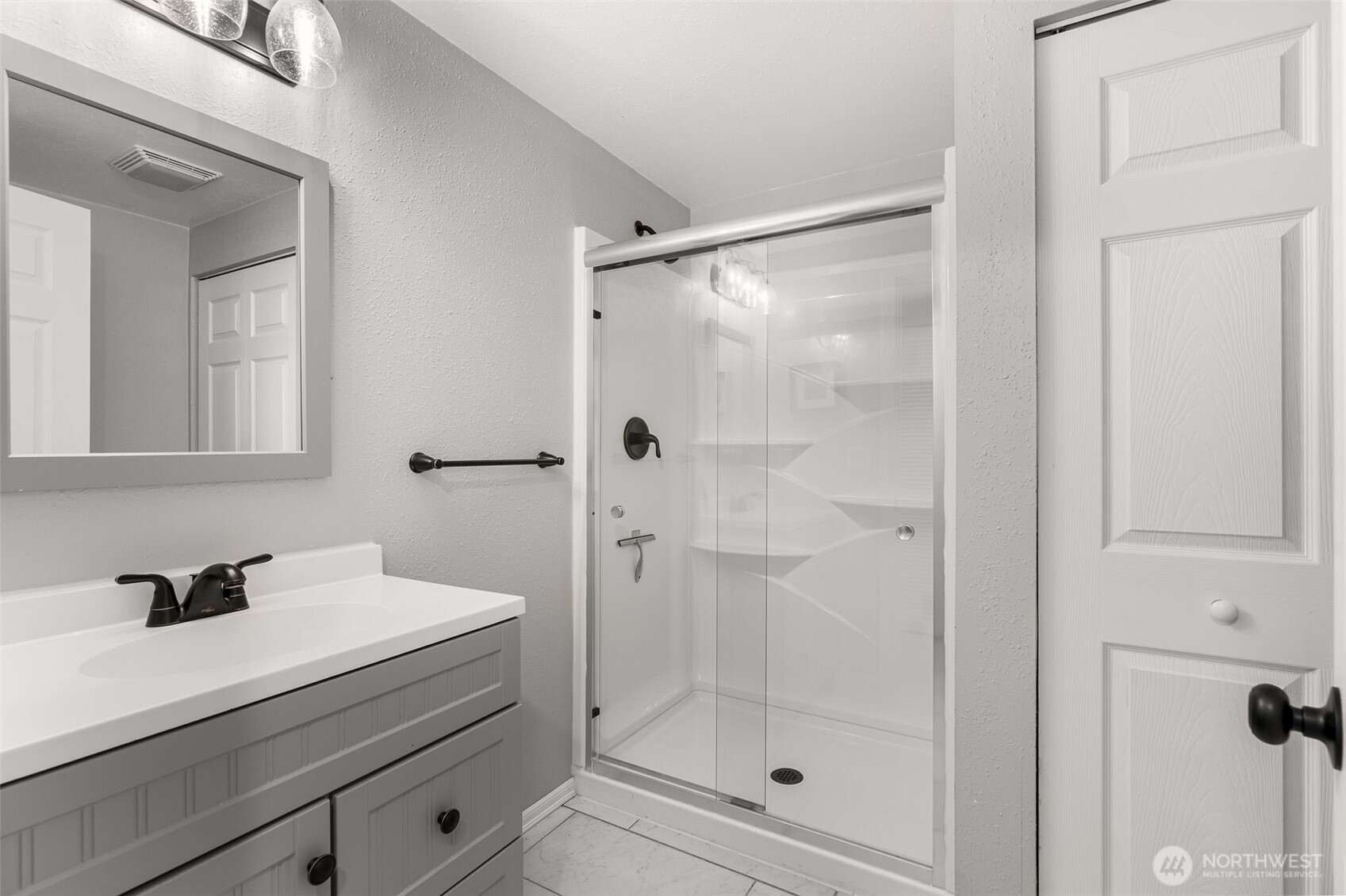 1128 203rd Place Southeast Bothell, WA 98012 - Photo 27 of 38 a bathroom with a shower sink and mirror
