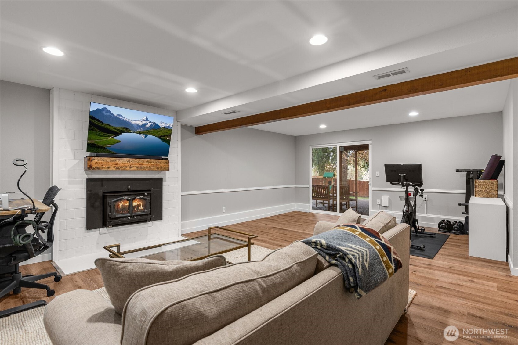 1128 203rd Place Southeast Bothell, WA 98012 - Photo 30 of 38 a bedroom with a bed and a fireplace