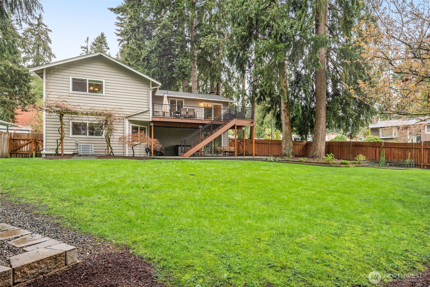 1128 203rd Place Southeast Bothell, WA 98012 - Photo 36 of 38 a front view of a house with garden