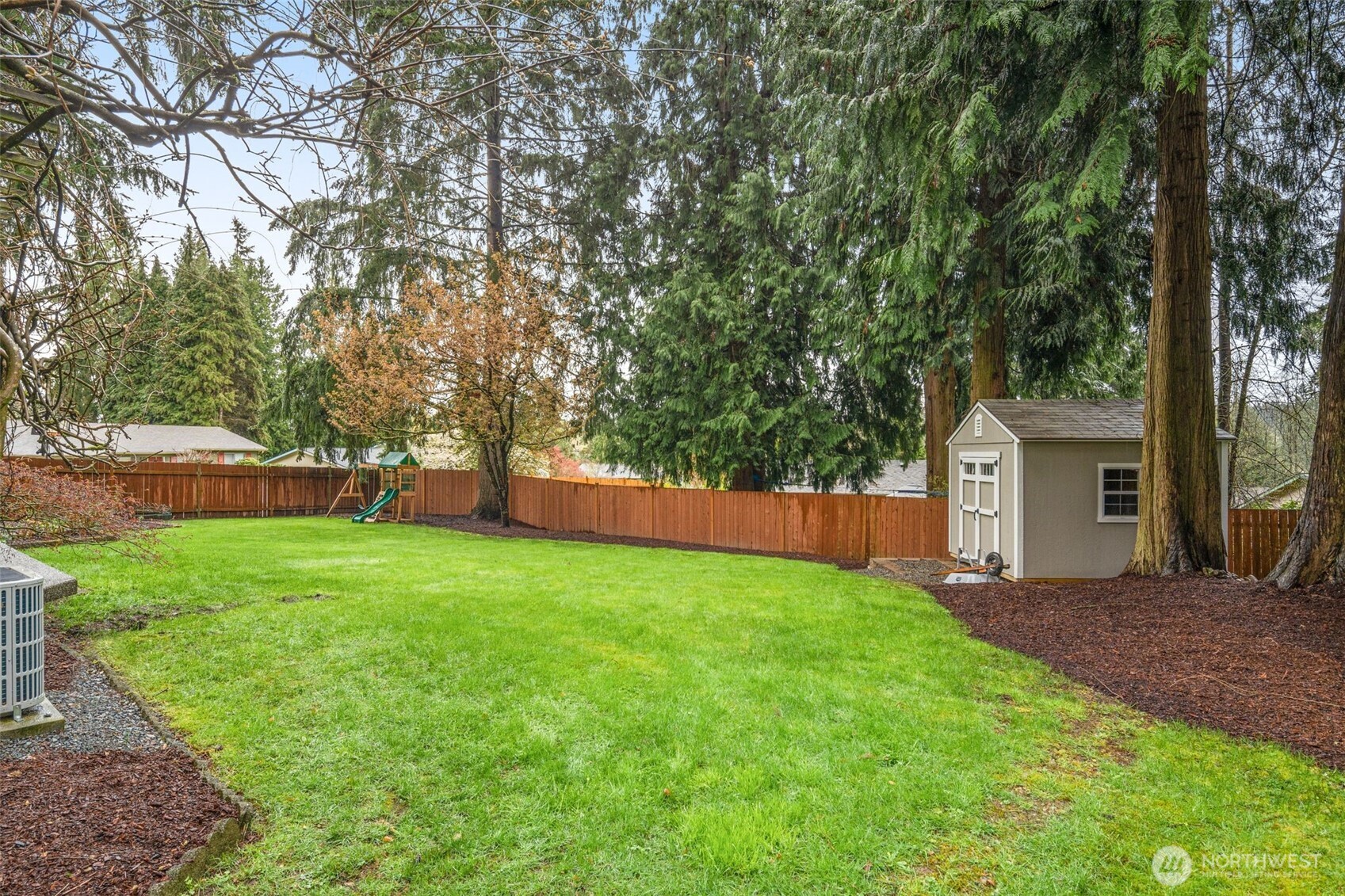1128 203rd Place Southeast Bothell, WA 98012 - Photo 37 of 38 a view of a house with backyard and a tree