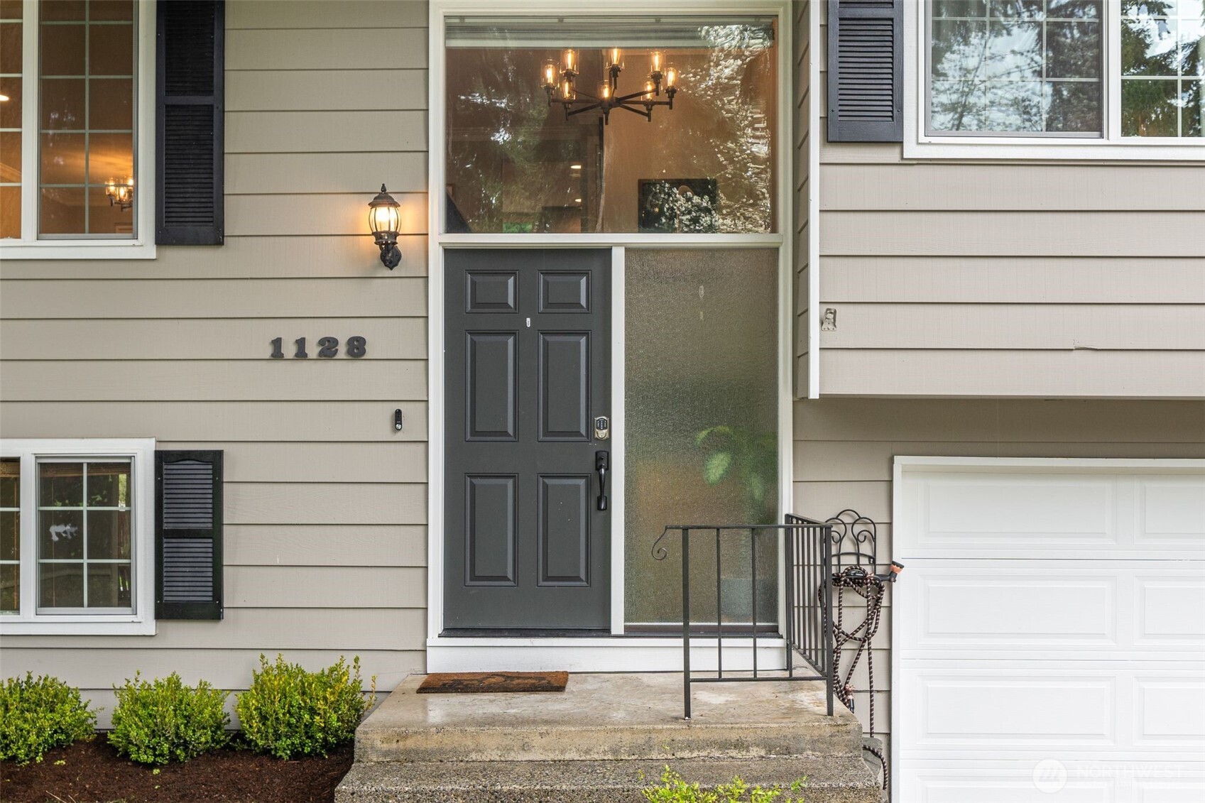1128 203rd Place Southeast Bothell, WA 98012 - Photo 4 of 38 a view of entrance gate of the house and a window