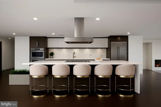 a kitchen with a table and chairs in it