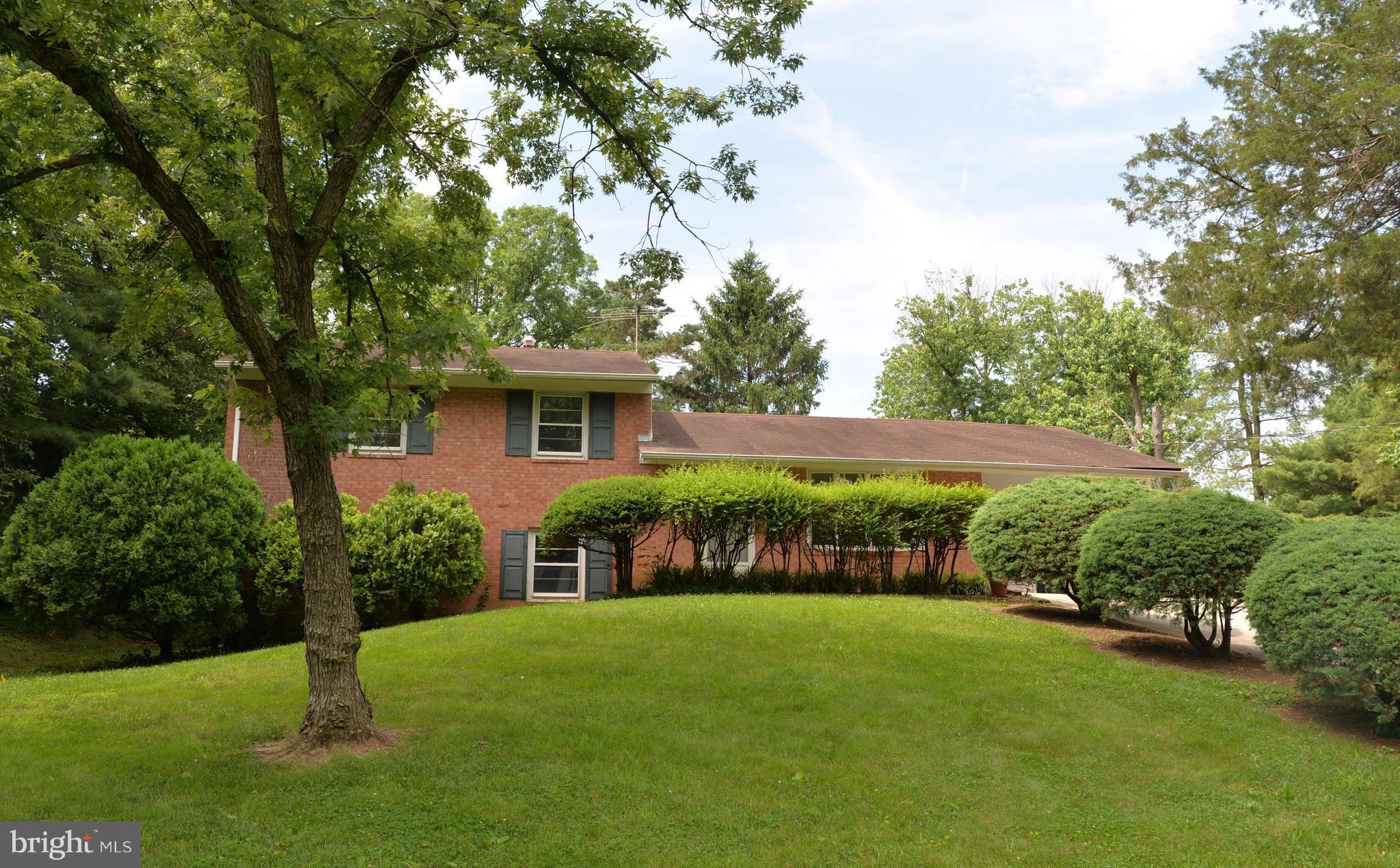 6427 Pima Street Alexandria, VA 22312 - Photo 1 of 30 a front view of a house with garden