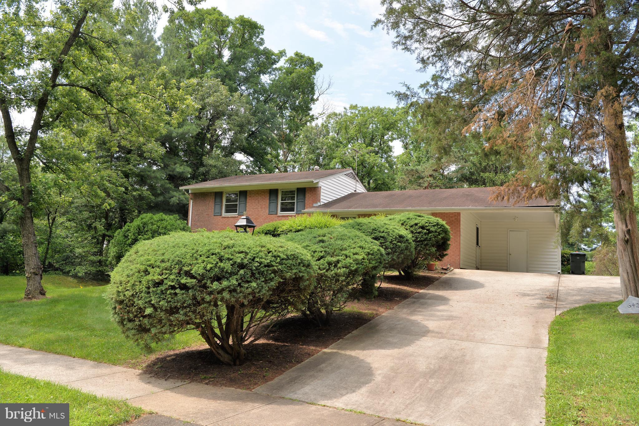 6427 Pima Street Alexandria, VA 22312 - Photo 2 of 30 a front view of a house with a yard