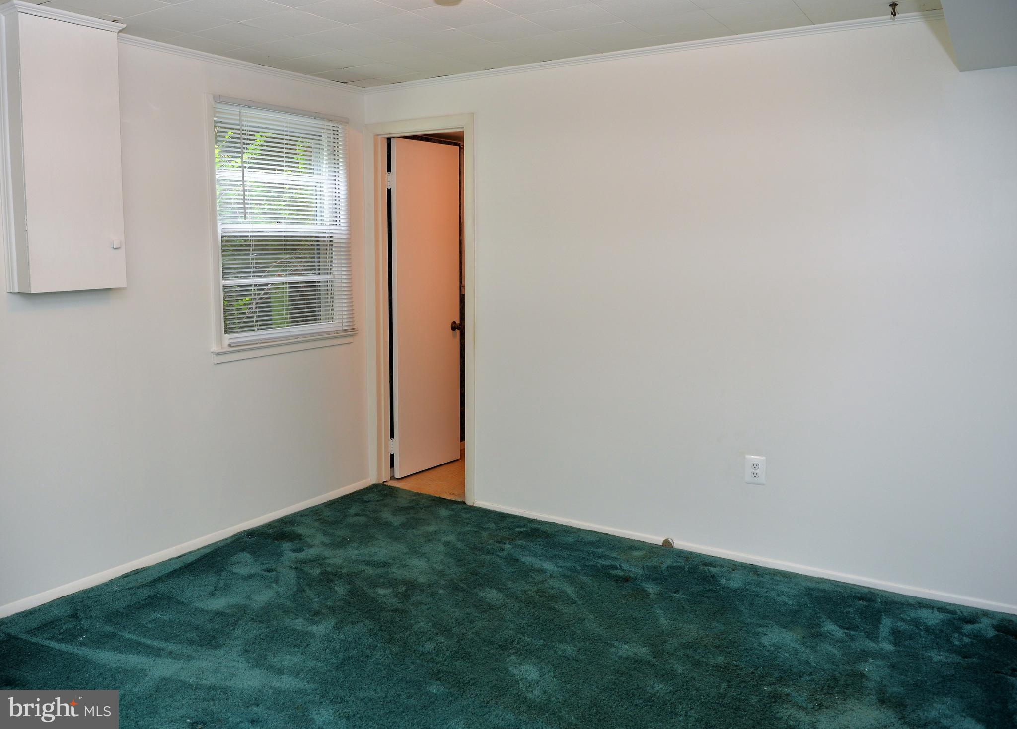 6427 Pima Street Alexandria, VA 22312 - Photo 18 of 30 a view of an empty room with a window
