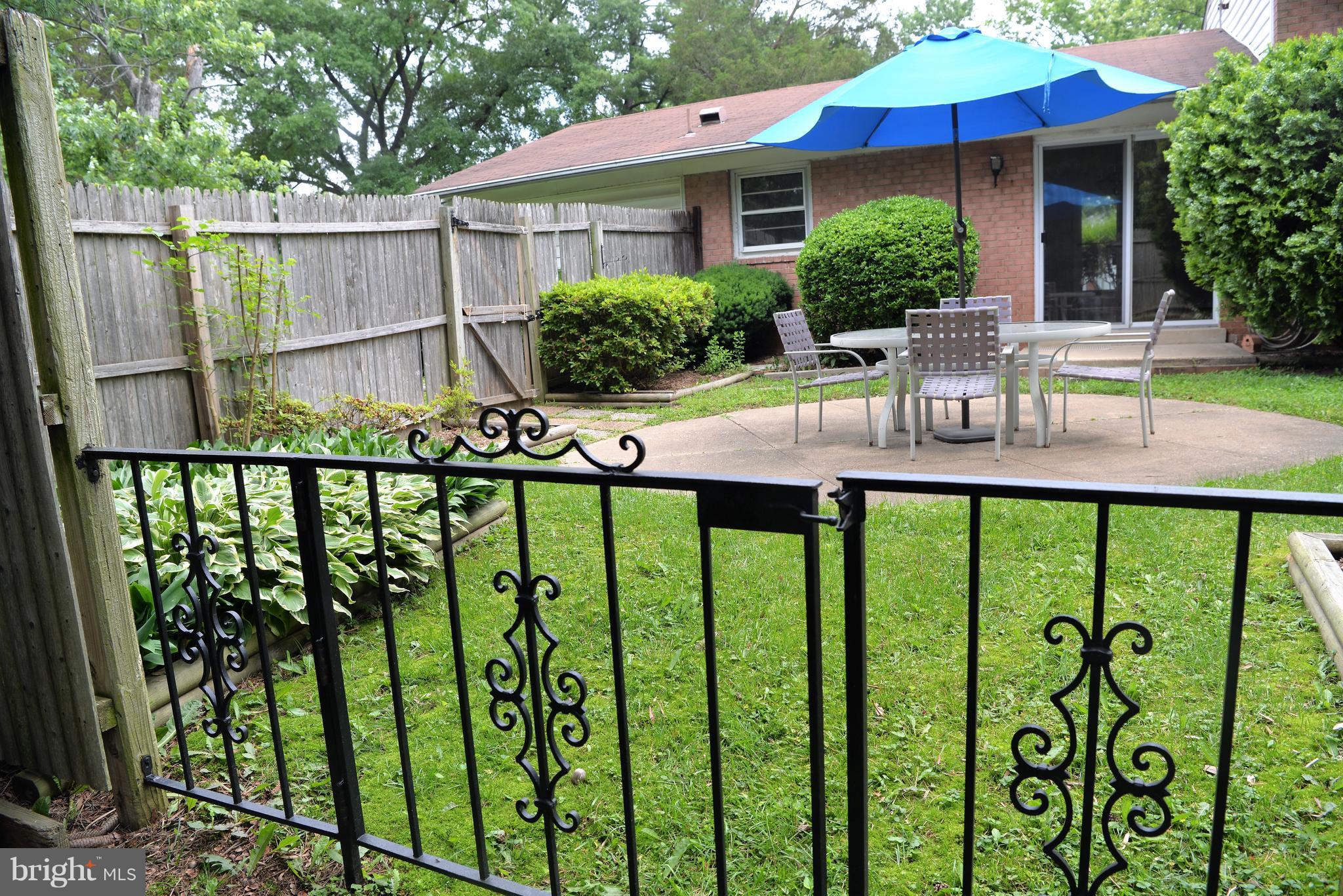 6427 Pima Street Alexandria, VA 22312 - Photo 28 of 30 a view of house with a swimming pool and outdoor seating