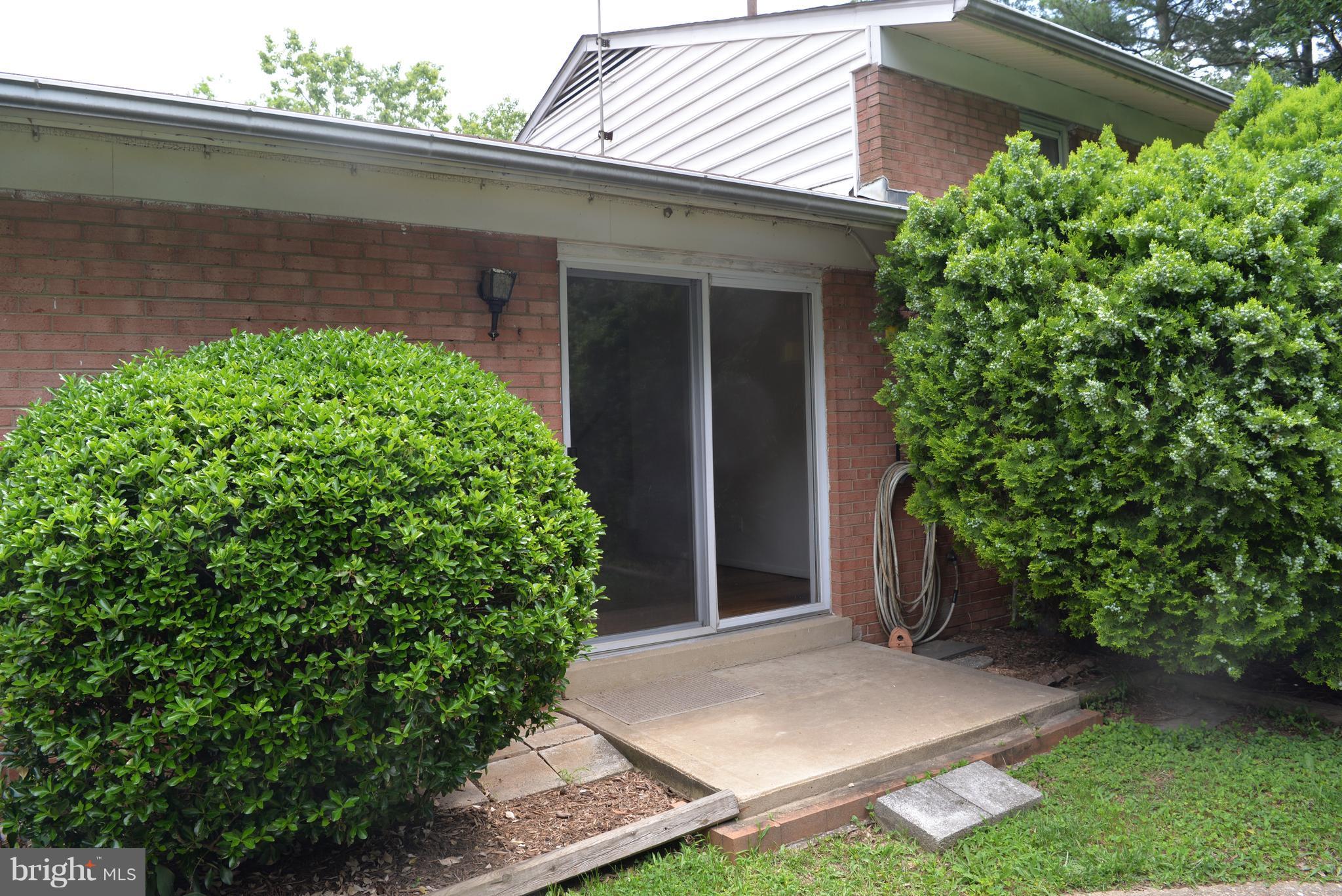 6427 Pima Street Alexandria, VA 22312 - Photo 29 of 30 front view of a house with a yard