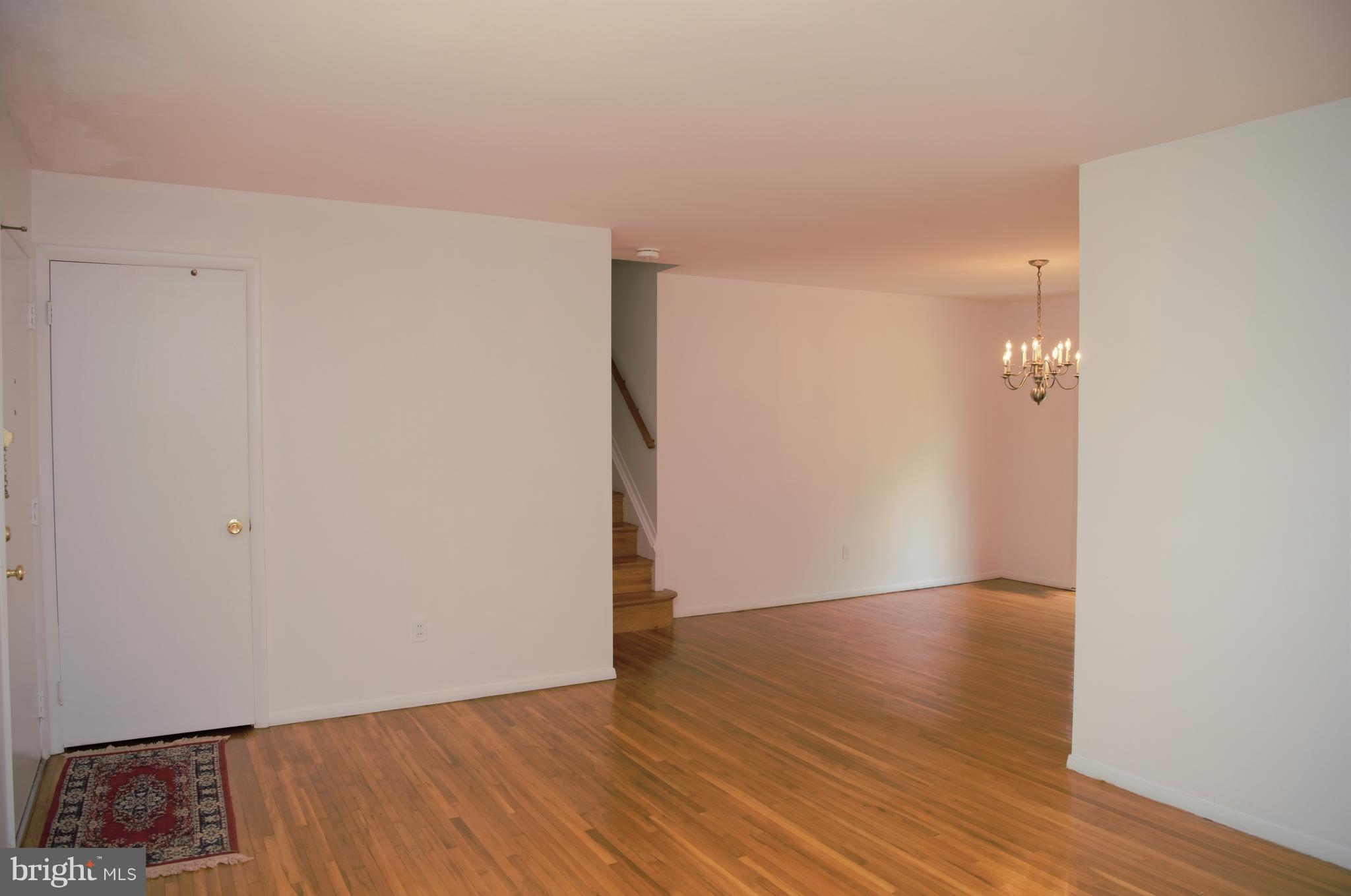 6427 Pima Street Alexandria, VA 22312 - Photo 5 of 30 a view of an empty room with wooden floor