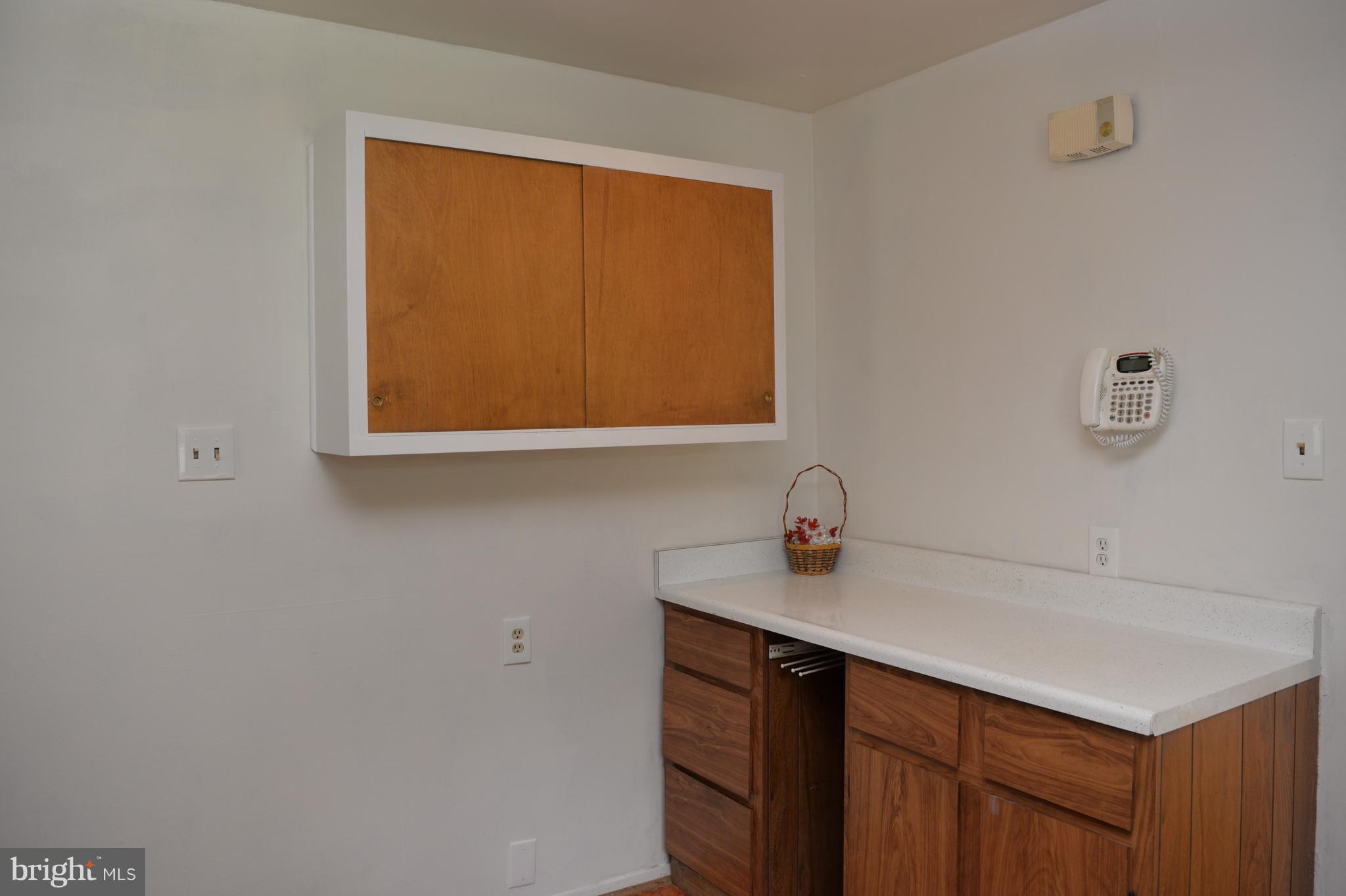 6427 Pima Street Alexandria, VA 22312 - Photo 9 of 30 a kitchen with a sink and a window
