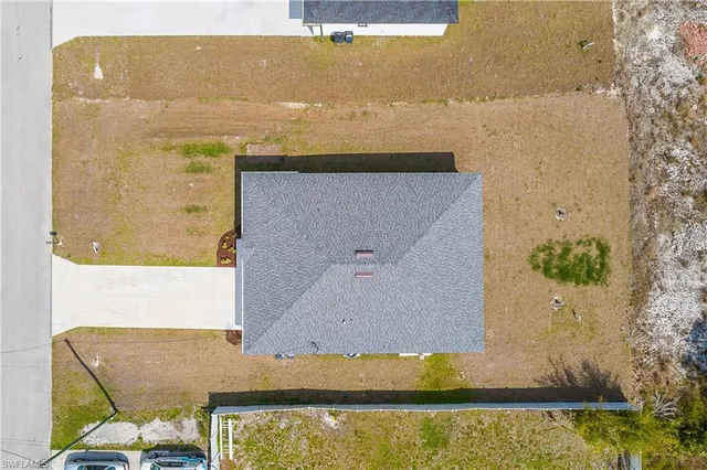 a house with swimming pool in front of it