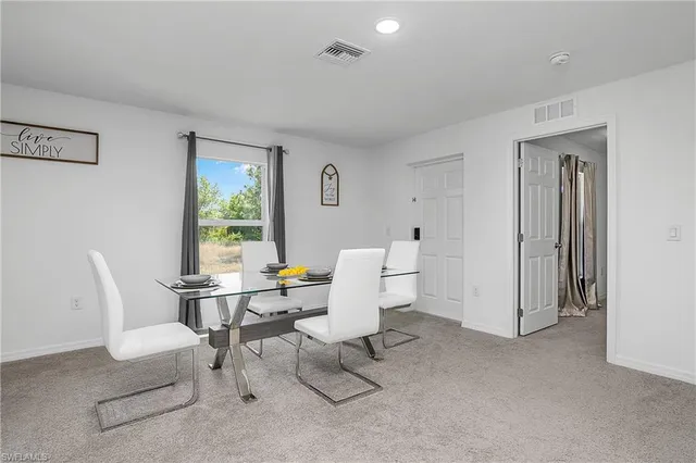 a living room with furniture a window and a table