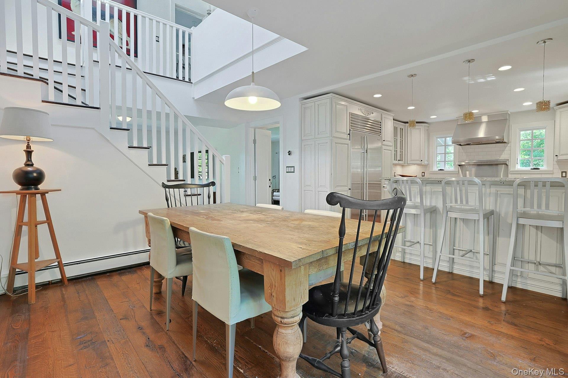 65 Douglas Road Chappaqua, NY 10514 - Photo 15 of 41 The dining area connects beautifully with the kitchen, creating an easy, inviting flow for everyday meals, casual conversation, and effortless entertaining.