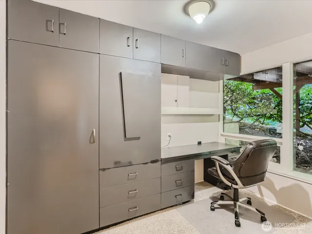 a view of a workspace with furniture