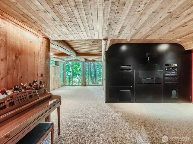 a view of a livingroom with furniture and staircase