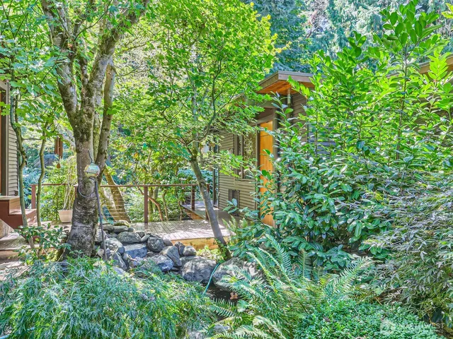 a backyard of a house with lots of green space