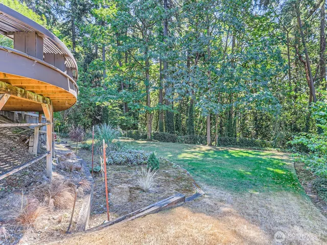 a backyard of a house with lots of green space