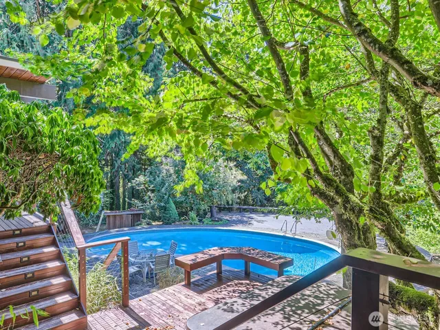 a view of yard from deck having patio