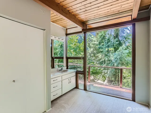 a view of a room with window and pool table
