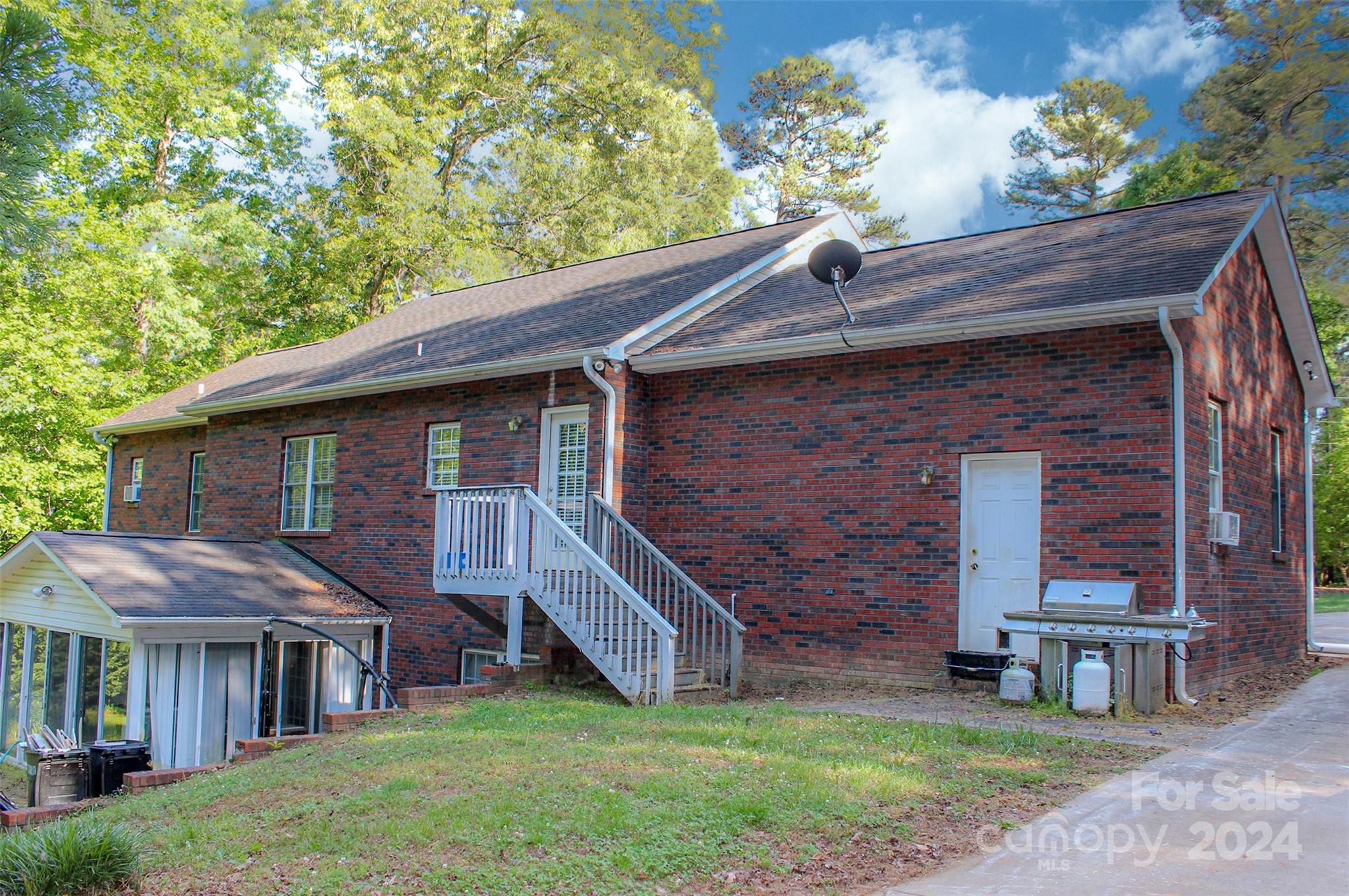 1117 Blacksnake Road Stanley, NC 28164 - Photo 3 of 27 a front view of a house with garden