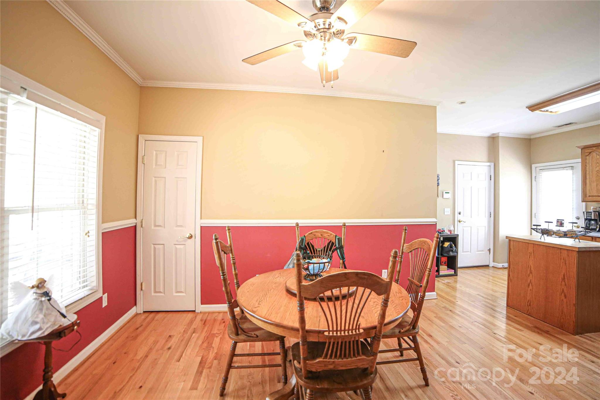 1117 Blacksnake Road Stanley, NC 28164 - Photo 7 of 27 a view of a dining room with furniture window and wooden floor