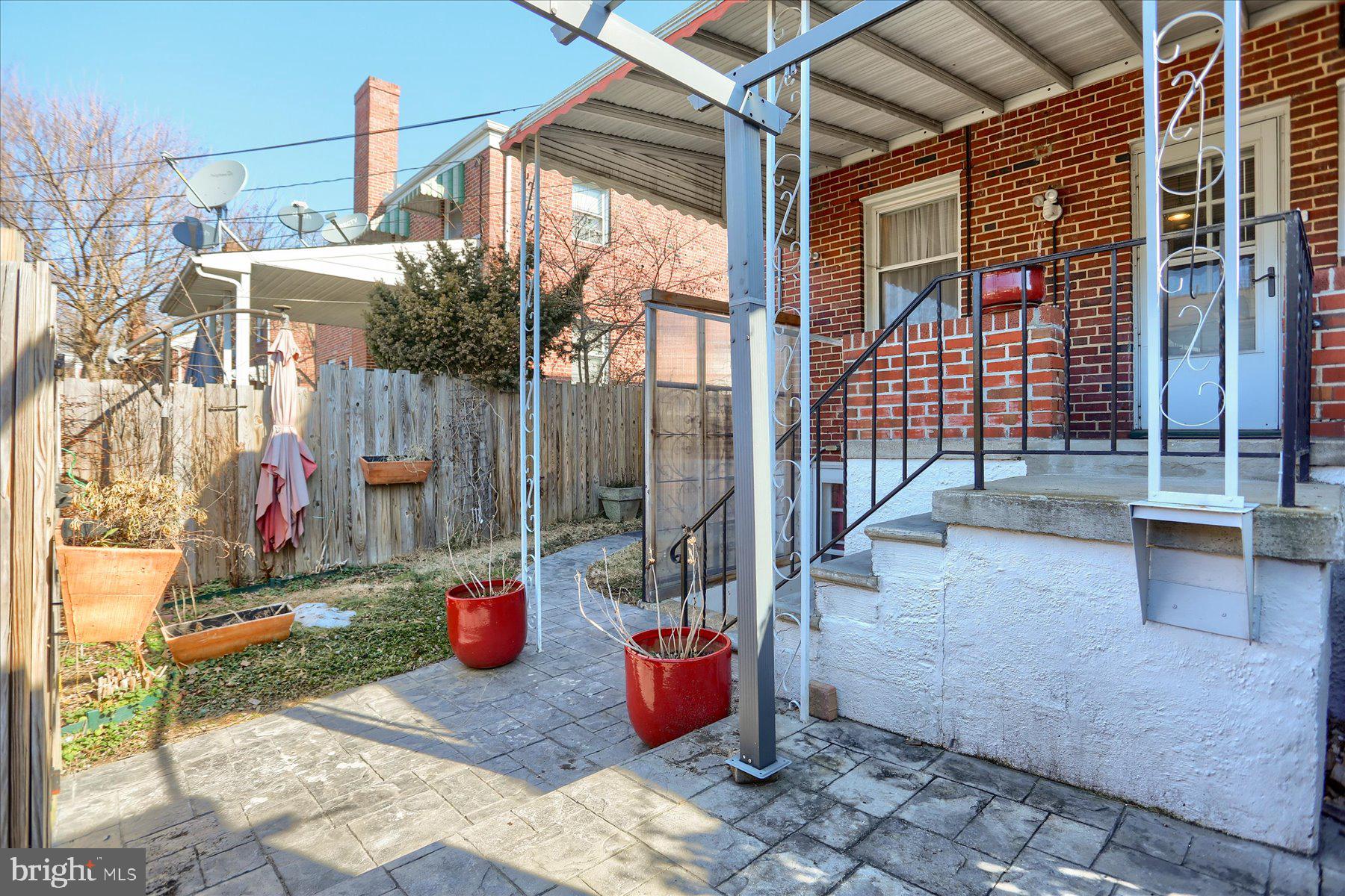 2616 Liberty Parkway Baltimore, MD 21222 - Photo 31 of 41 a view of a patio with table and chairs and potted plants