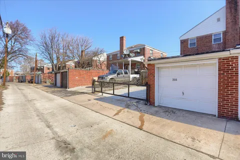 a view of a house with a snow in the background