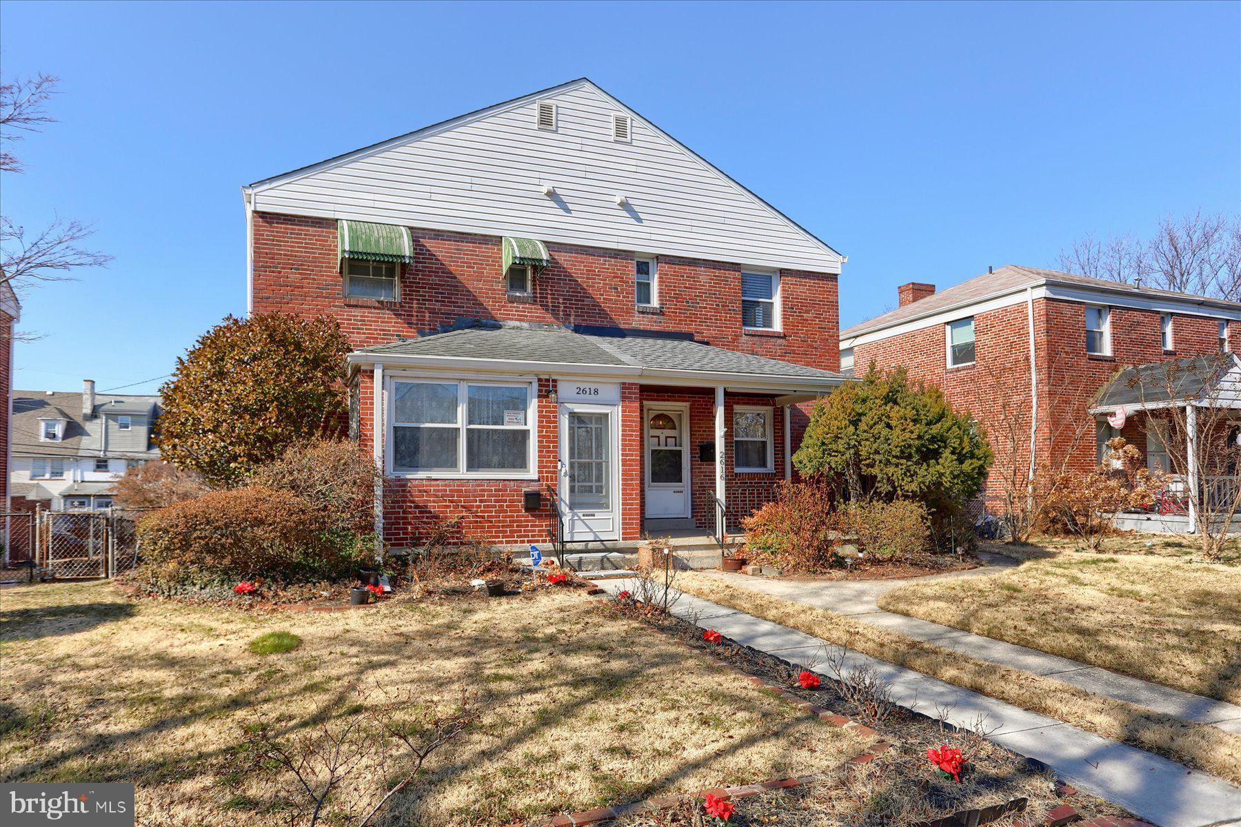 2616 Liberty Parkway Baltimore, MD 21222 - Photo 36 of 41 a front view of a house with a yard