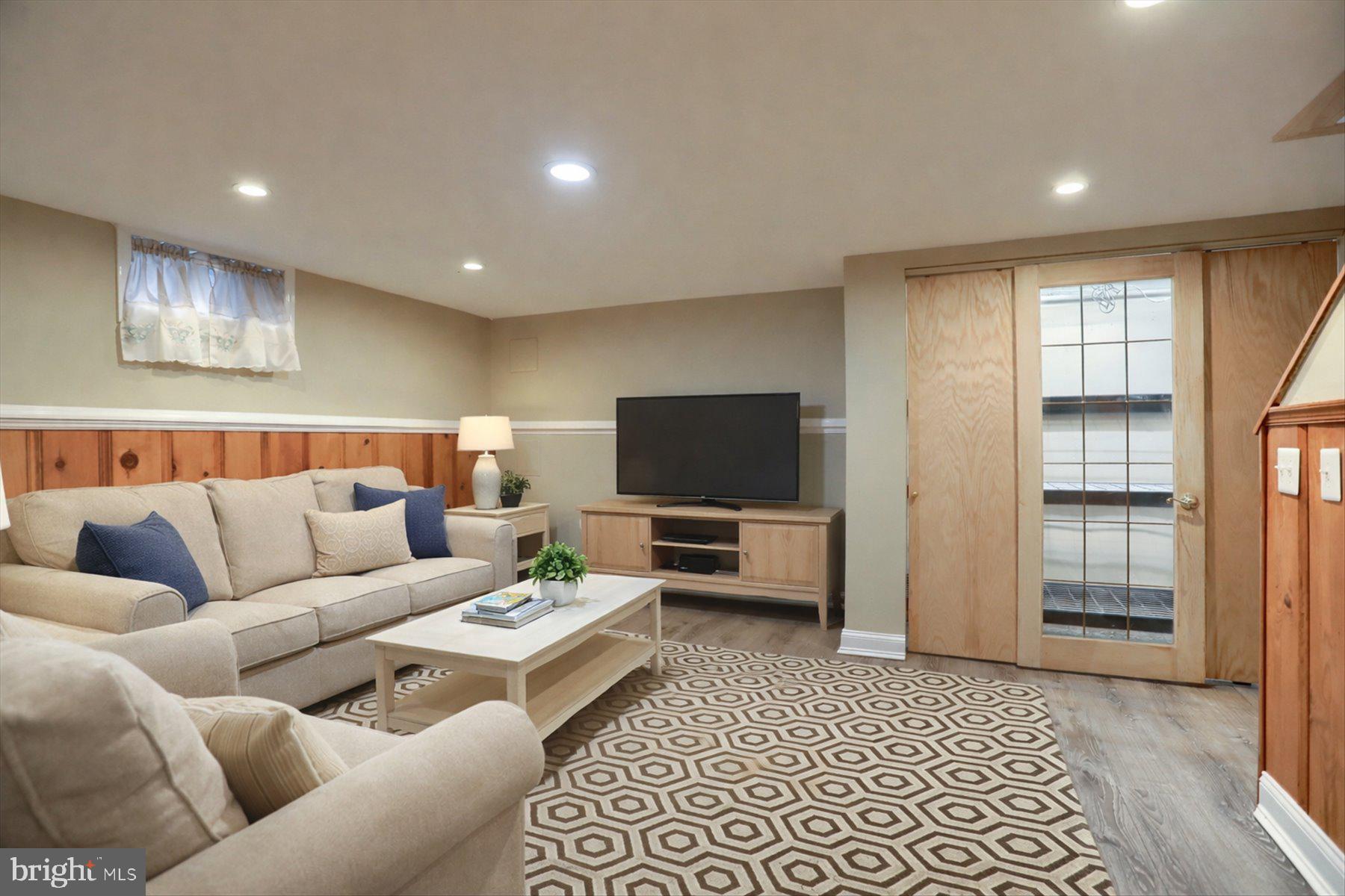 2616 Liberty Parkway Baltimore, MD 21222 - Photo 6 of 41 a living room with furniture and a flat screen tv