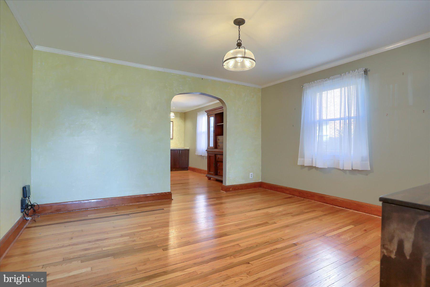 2616 Liberty Parkway Baltimore, MD 21222 - Photo 9 of 41 a view of empty room with wooden floor and window