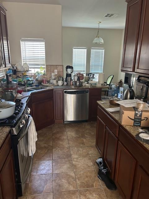 3833 Stepping Stone Way Stockton, CA 95204 - Photo 3 of 6 a kitchen with a sink appliances and cabinets