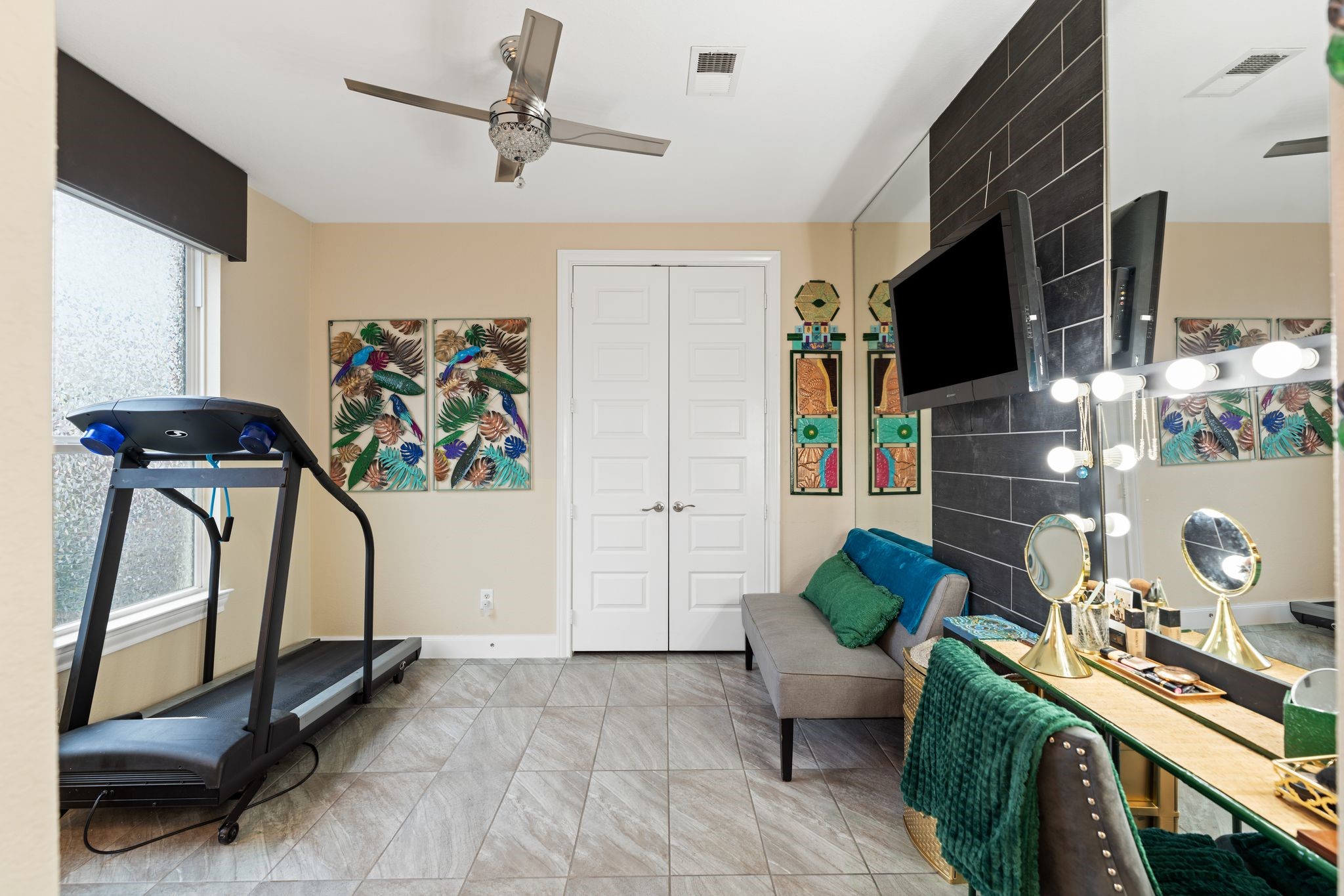 51 Scepter Ridge Sugar Land, TX 77498 - Photo 31 of 48 a living room with furniture gym equipment and a flat screen tv