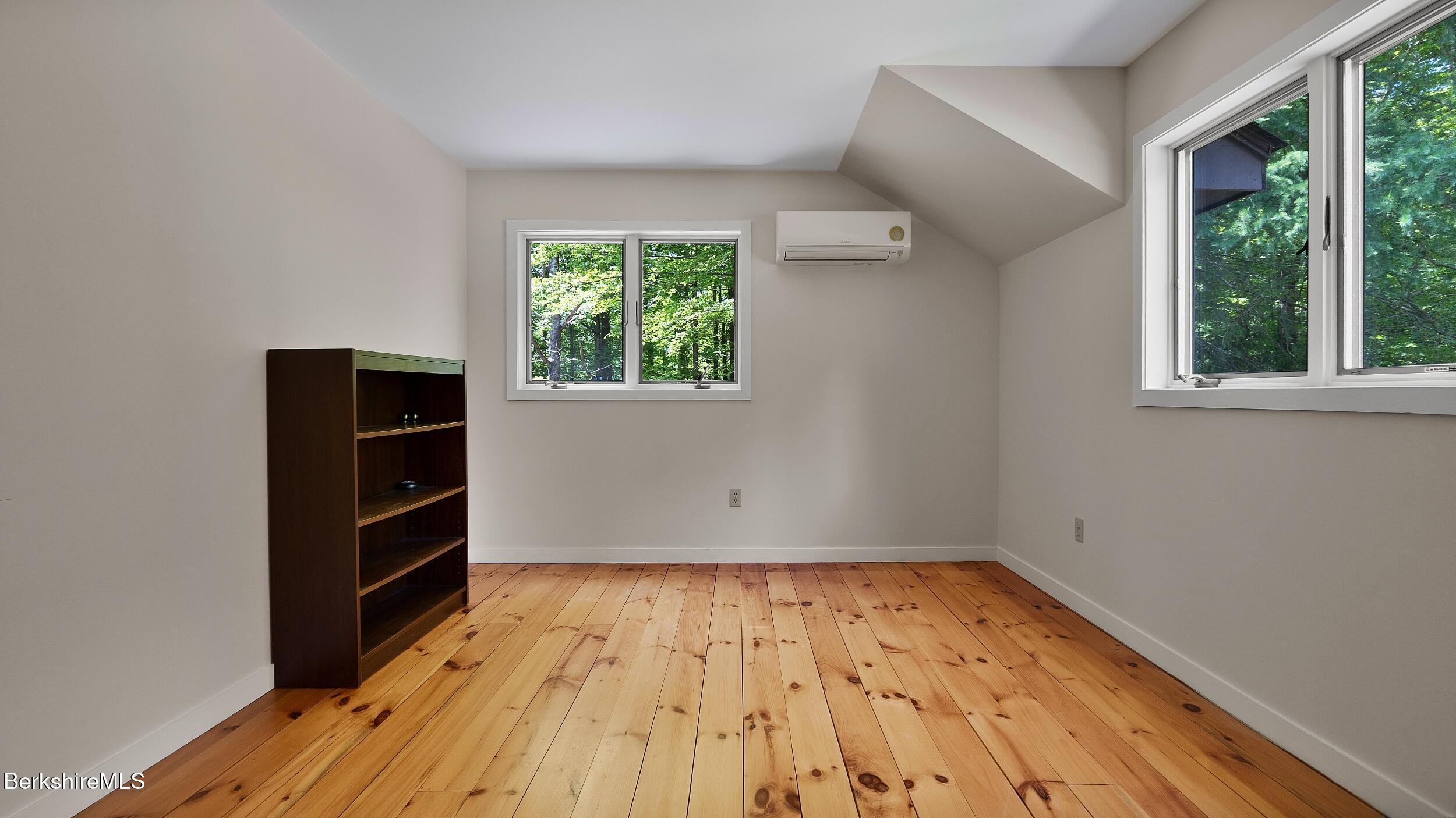 173 Hillsdale Road Egremont, MA 01230 - Photo 67 of 82 an empty room with wooden floor closet and windows