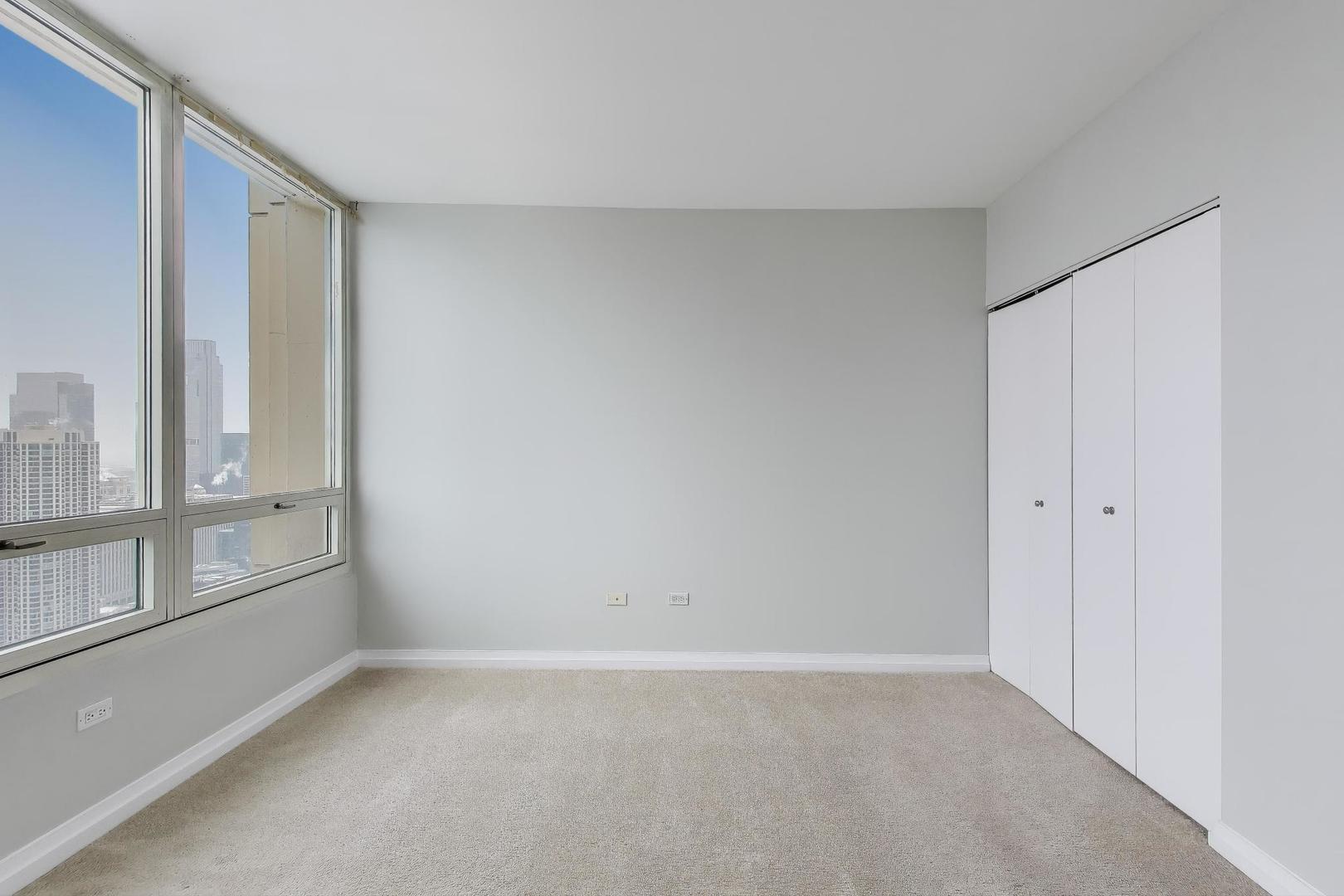 33 West Ontario Street, Unit 46C Chicago, IL 60654 - Photo 12 of 32 a view of an empty room with a window
