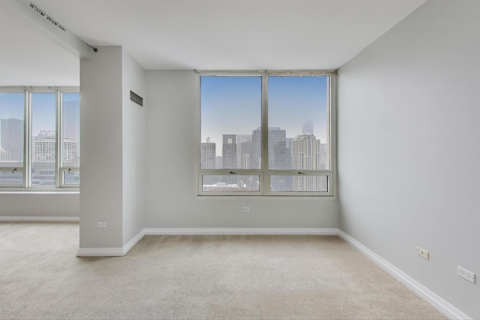 33 West Ontario Street, Unit 46C Chicago, IL 60654 - Photo 13 of 32 a view of an empty room with a window