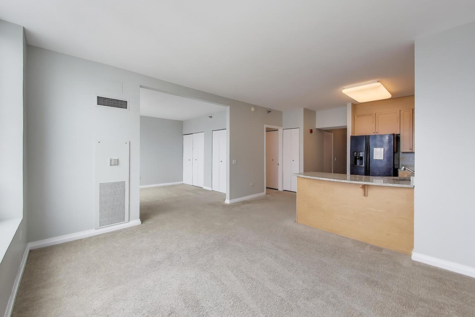 33 West Ontario Street, Unit 46C Chicago, IL 60654 - Photo 7 of 32 a view of kitchen with refrigerator and window